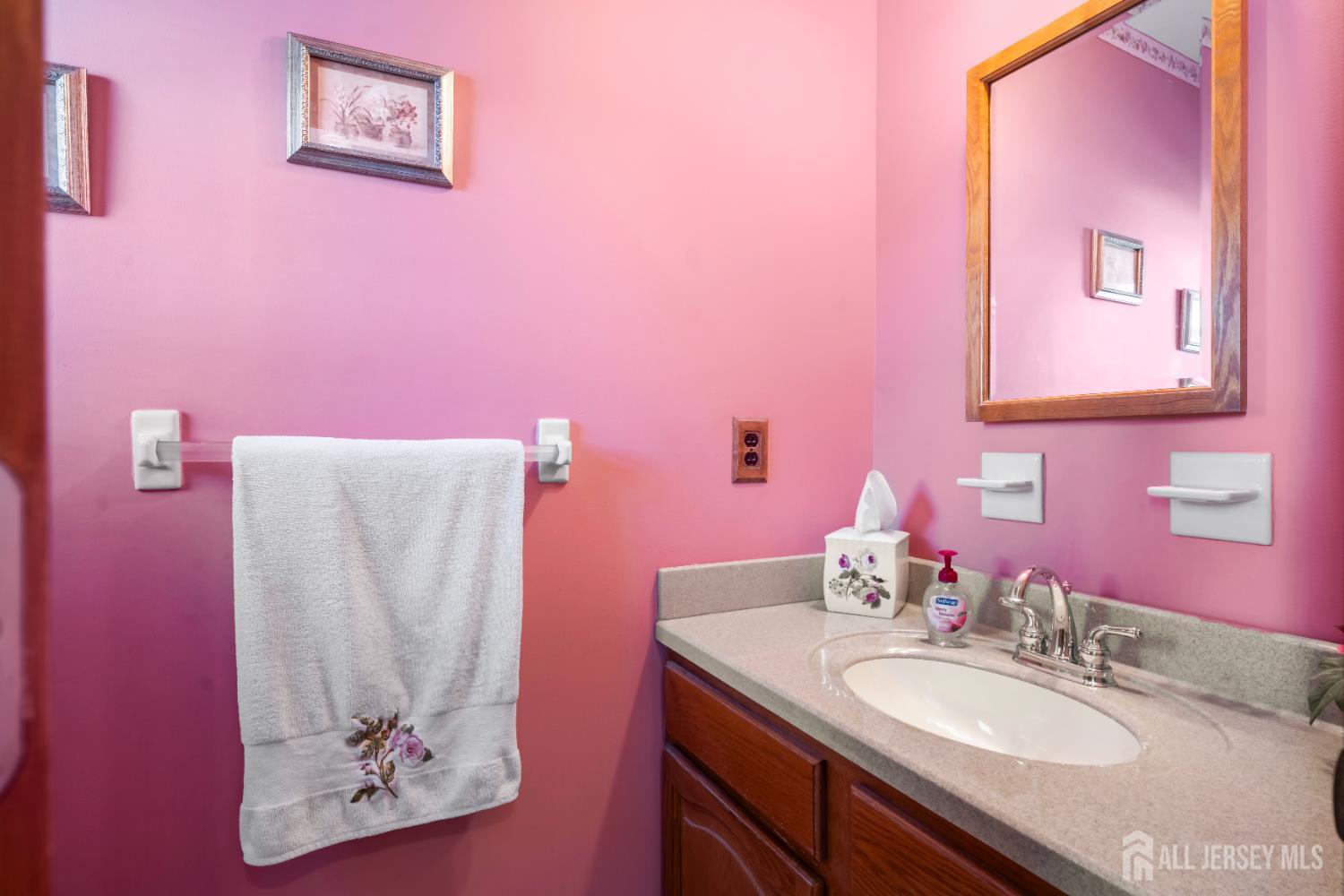 6 Marie Lane Edison, NJ 08817 - Photo 16 of 35 a bathroom with a sink vanity and a mirror