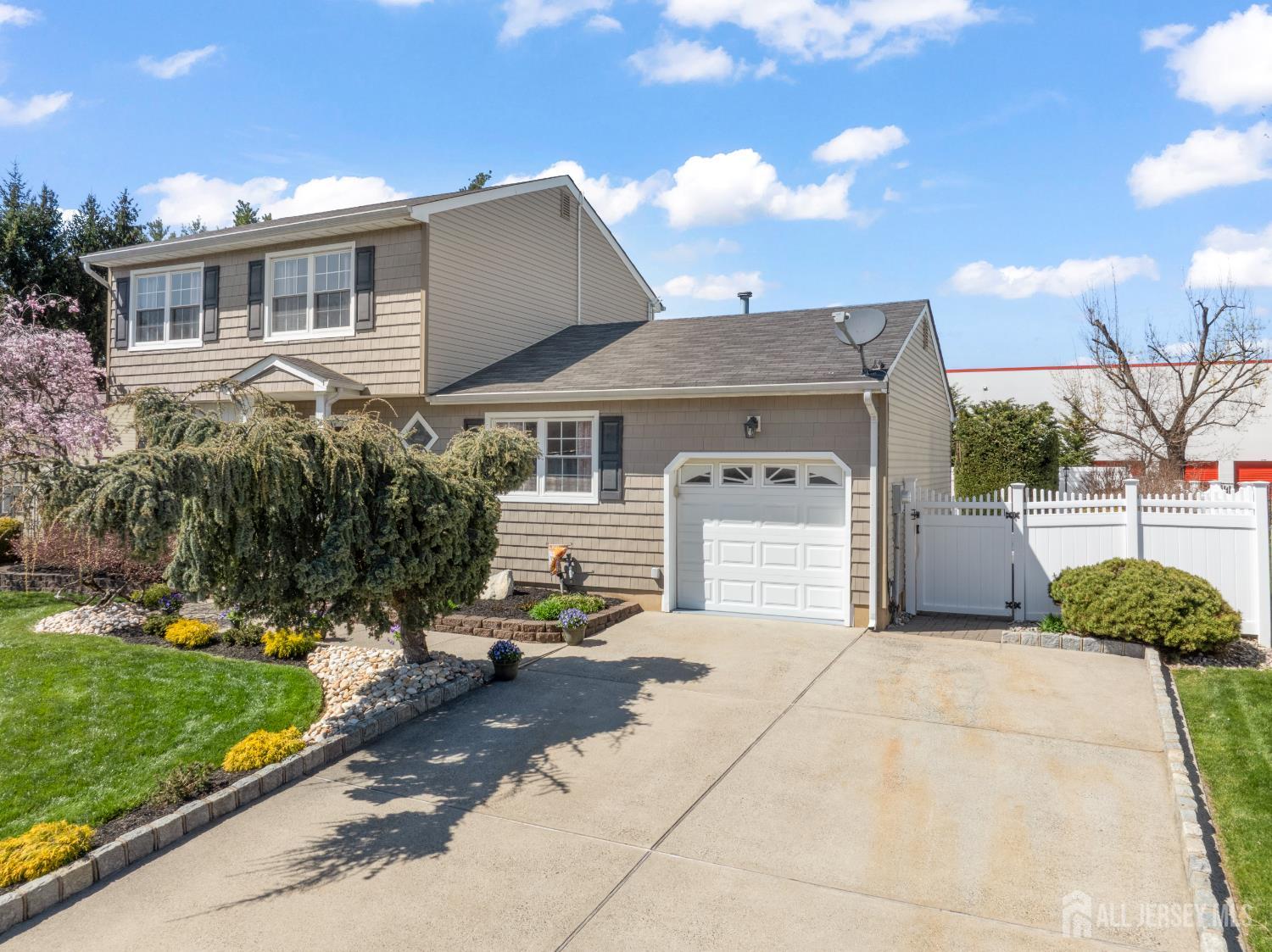 6 Marie Lane Edison, NJ 08817 - Photo 2 of 35 a front view of a house with a garden and mountain view