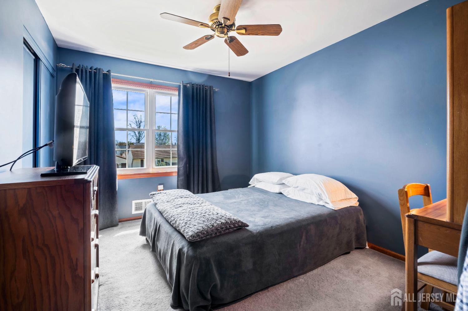 6 Marie Lane Edison, NJ 08817 - Photo 21 of 35 a bedroom with a bed and wooden floor