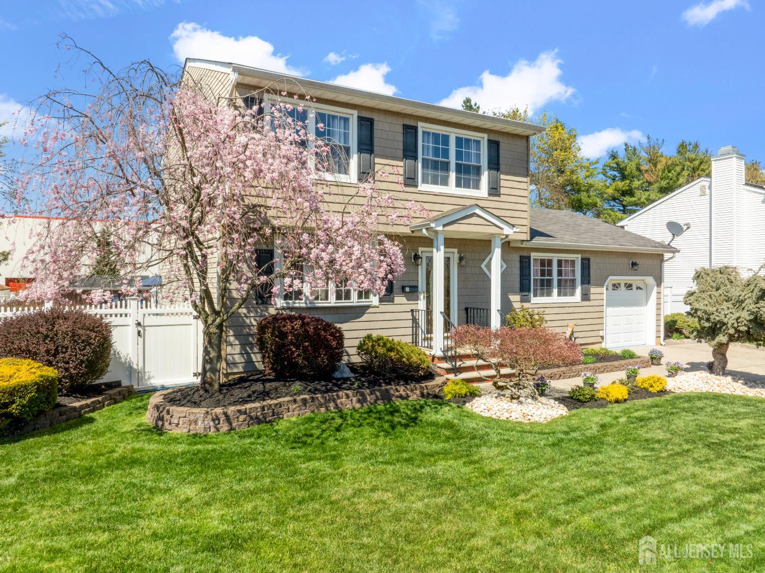 6 Marie Lane Edison, NJ 08817 - Photo 3 of 35 a front view of a house with a yard