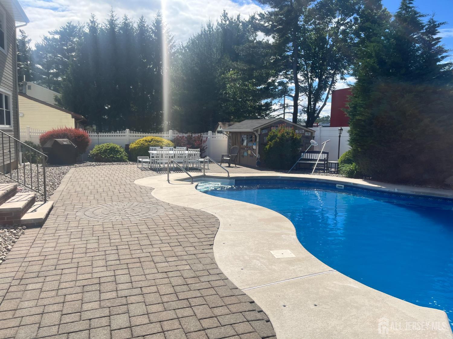 6 Marie Lane Edison, NJ 08817 - Photo 7 of 35 a view of a swimming pool with a patio