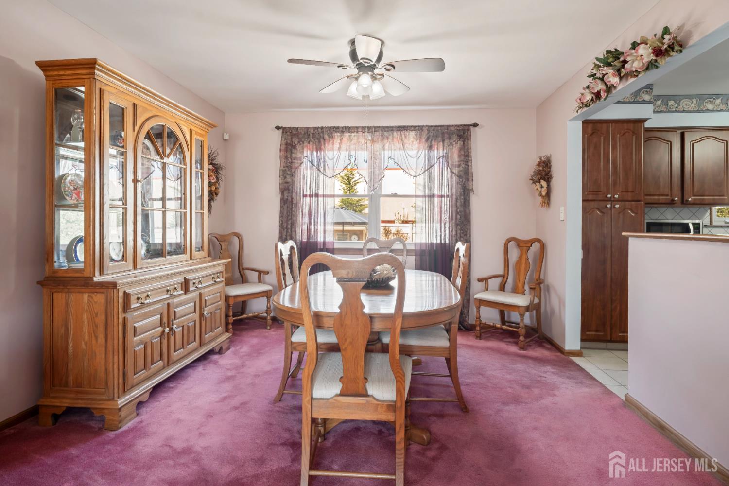 6 Marie Lane Edison, NJ 08817 - Photo 10 of 35 a view of a dining room with furniture window and wooden floor