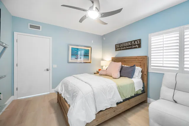 a bedroom with a bed couch and window