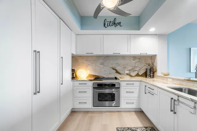 a view of a sink and cabinets