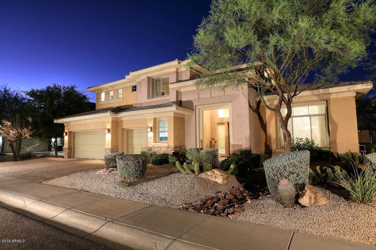 3736 East Maffeo Road Phoenix, AZ 85050 - Photo 3 of 62 a front view of a house with garden