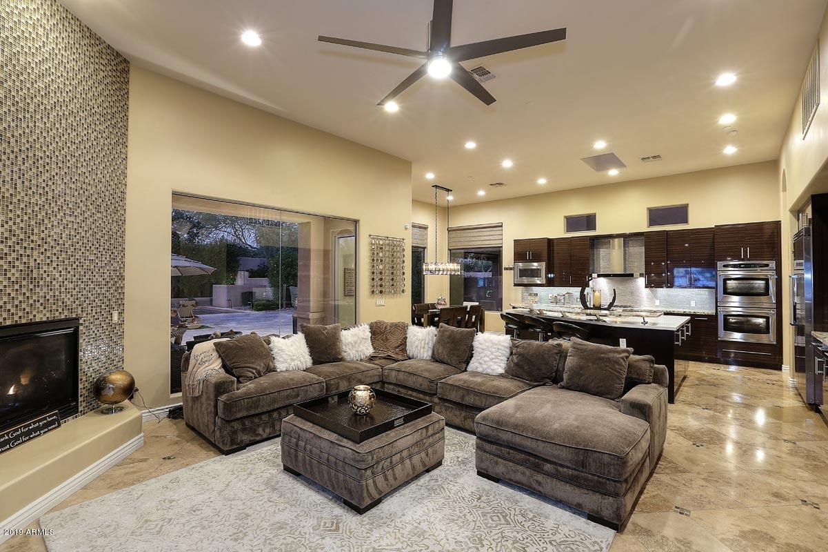 3736 East Maffeo Road Phoenix, AZ 85050 - Photo 4 of 62 a living room with furniture kitchen and a fireplace