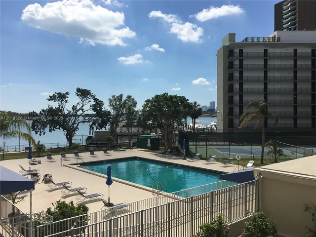 a view of outdoor space with swimming pool and patio