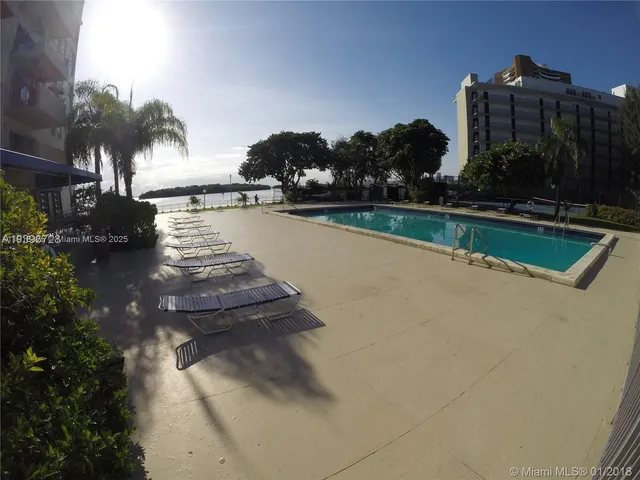 a view of swimming pool from a lake view