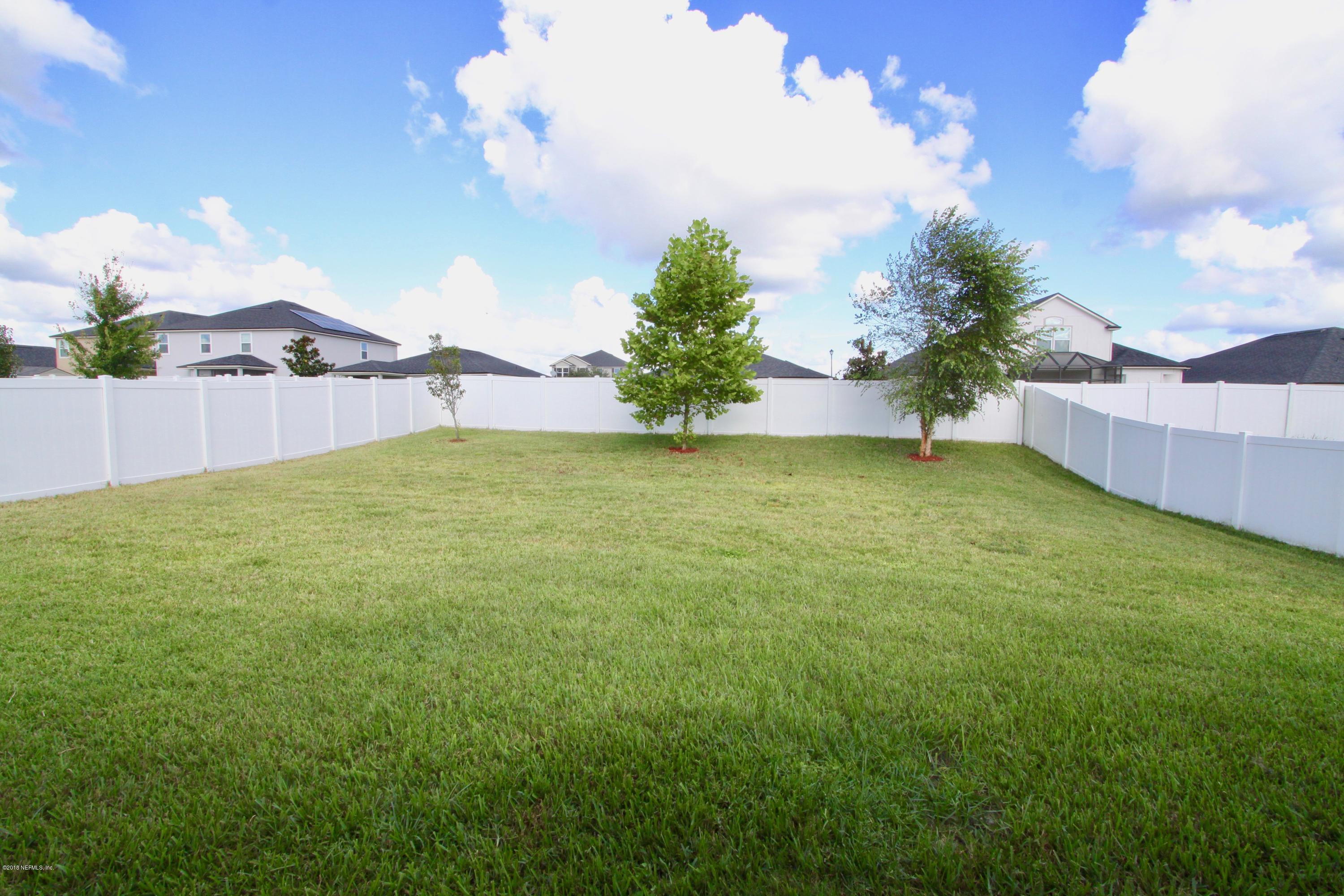 1915 High Prairie Lane Middleburg, FL 32068 - Photo 28 of 34 a view of swimming pool with an outdoor space and seating area