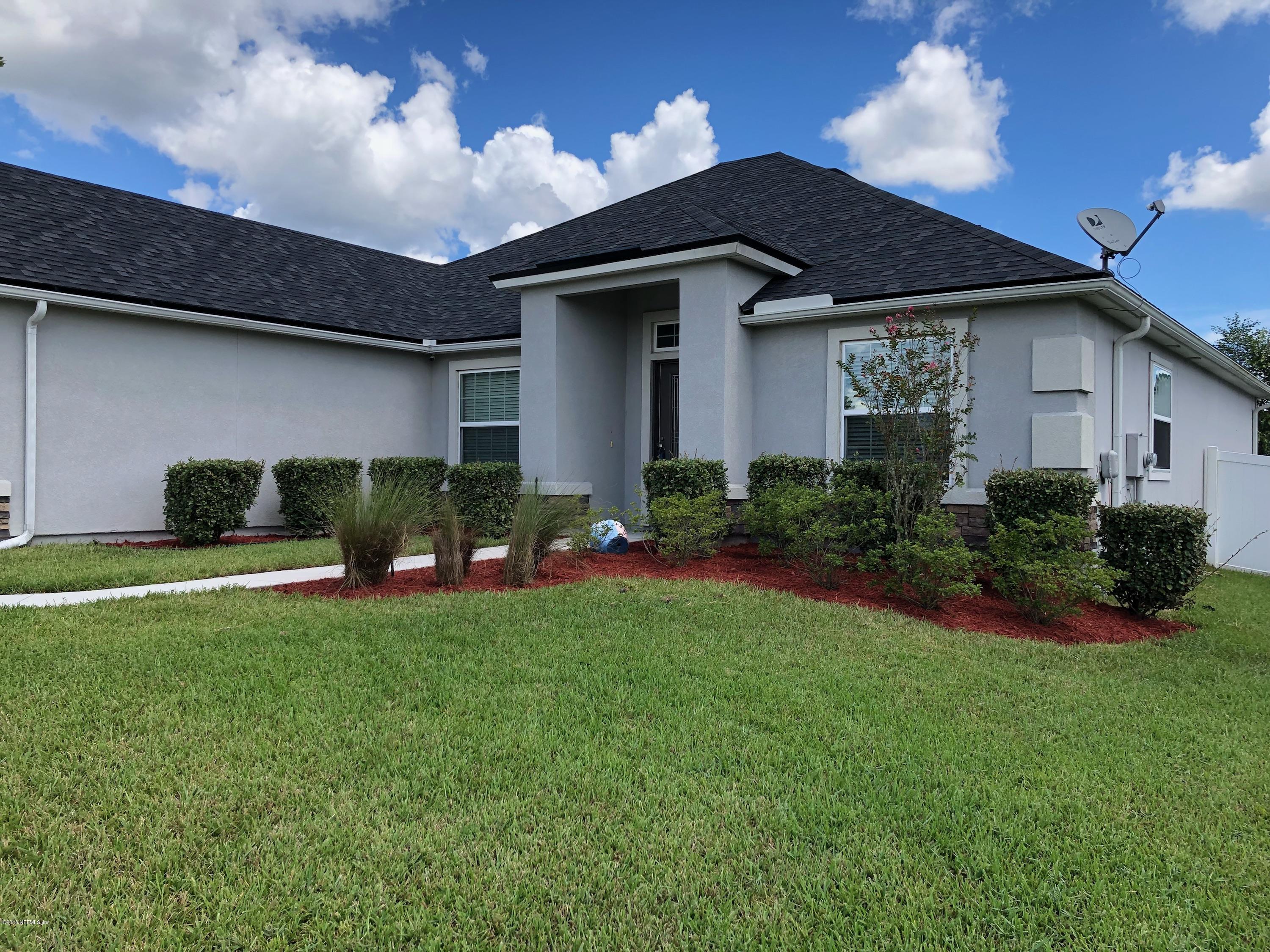 1915 High Prairie Lane Middleburg, FL 32068 - Photo 34 of 34 a front view of house with yard and outdoor seating