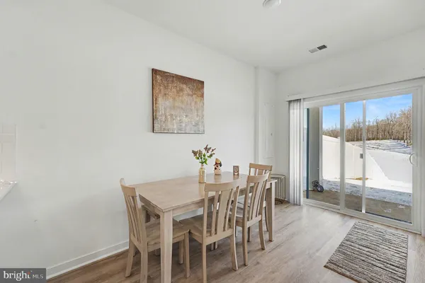 a view of a dining room with furniture wooden floor and a carpet