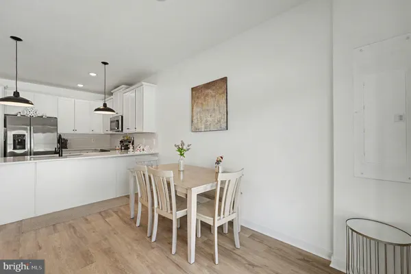 a view of kitchen with wooden floor and window