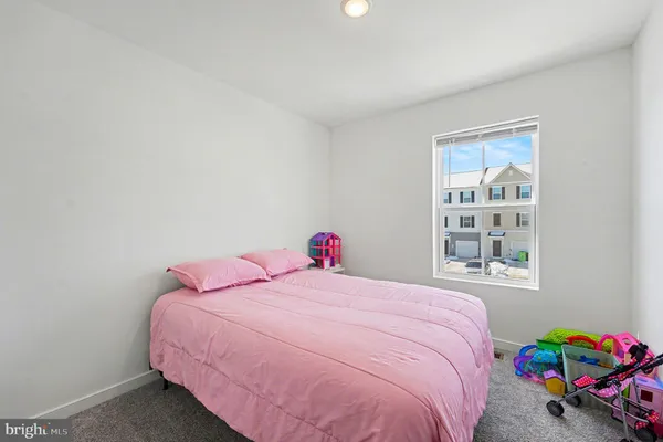 a bathroom with a sink vanity mirror and toilet