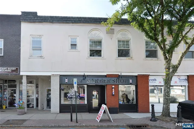 a front view of a building with glass windows