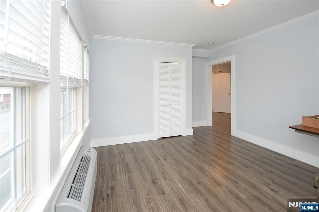 7 Main Street, Unit 2B Glen Rock, NJ 07452 - Photo 13 of 17 a view of a room with wooden floor and window