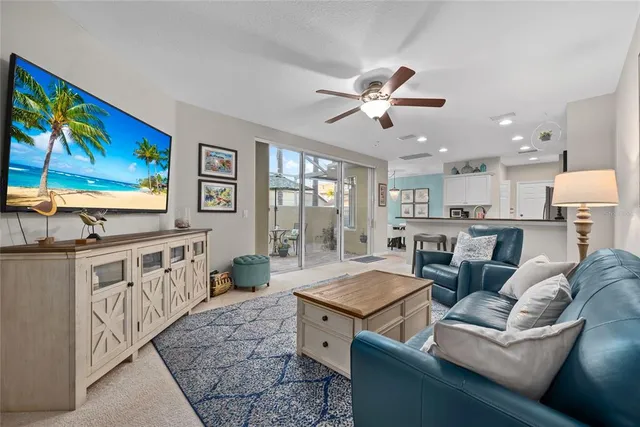 a view of living room kitchen with furniture and wooden floor