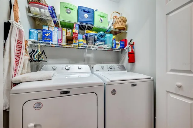 a utility room with dryer and washer