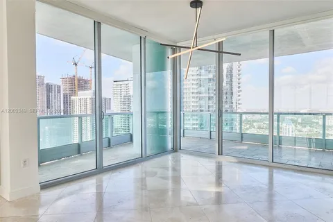 a bathroom with a glass door shower and door
