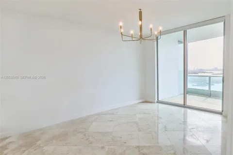 a view of an empty room with a glass door