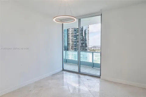 a view of a balcony with an outdoor seating