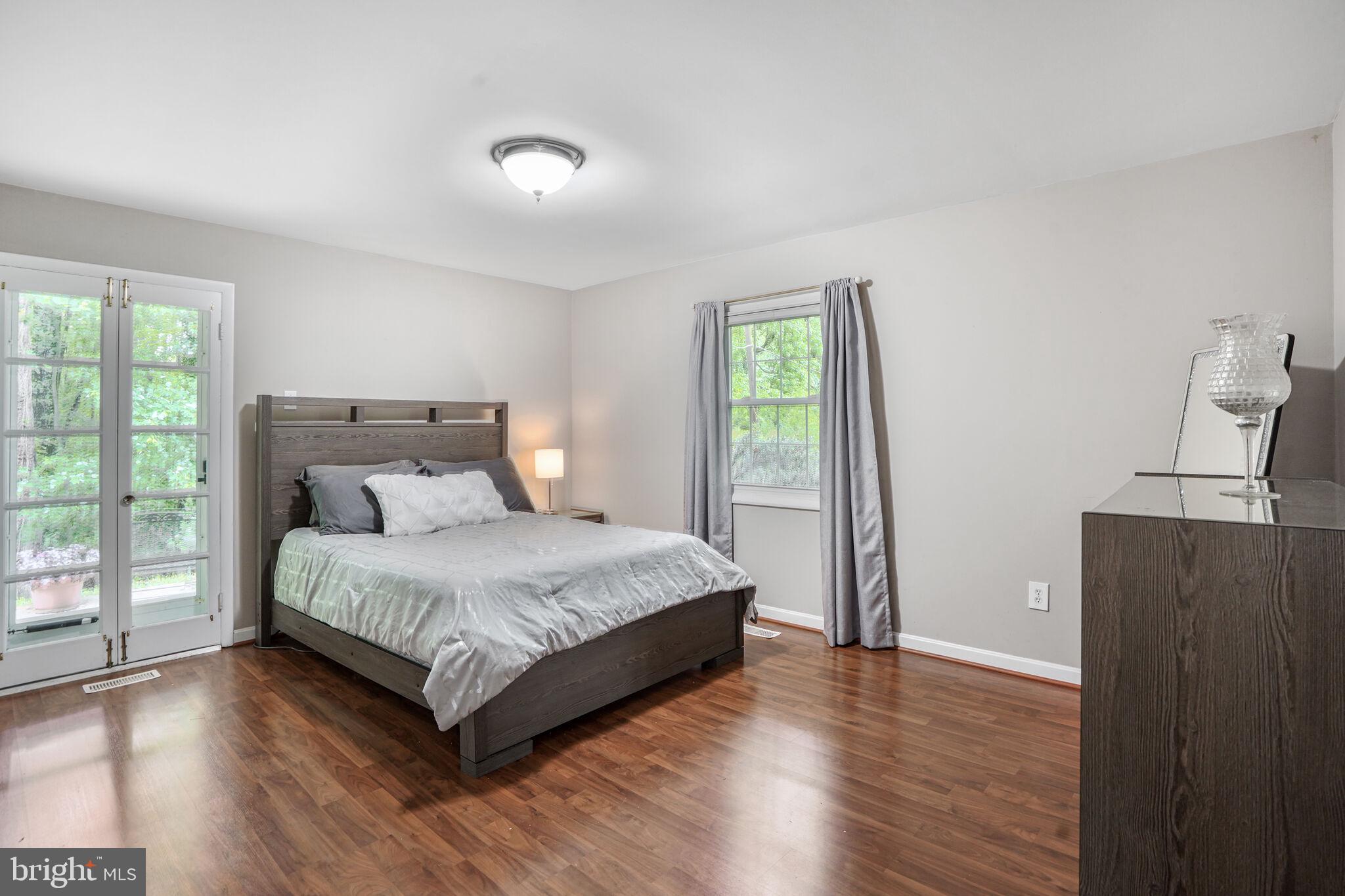 13030 Maple View Lane Fairfax, VA 22033 - Photo 13 of 30 a bedroom with a bed and window