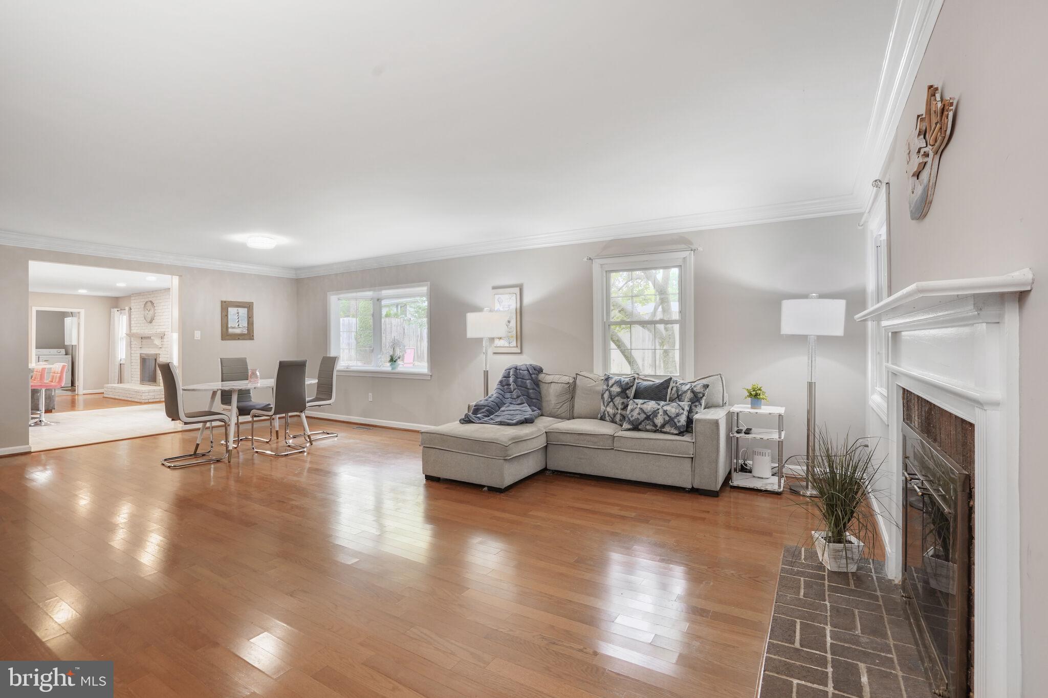 13030 Maple View Lane Fairfax, VA 22033 - Photo 2 of 30 a living room with fireplace furniture and a wooden floor