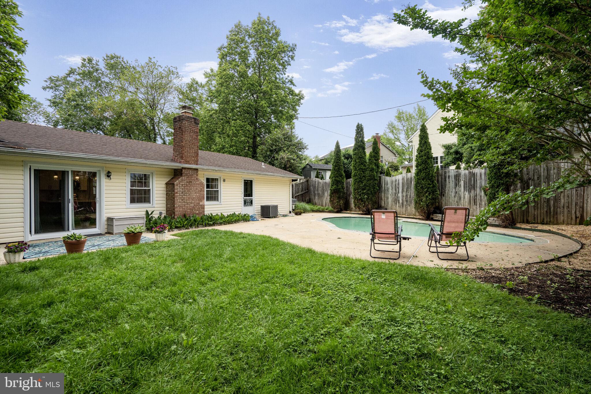 13030 Maple View Lane Fairfax, VA 22033 - Photo 22 of 30 a view of a house with backyard and sitting area