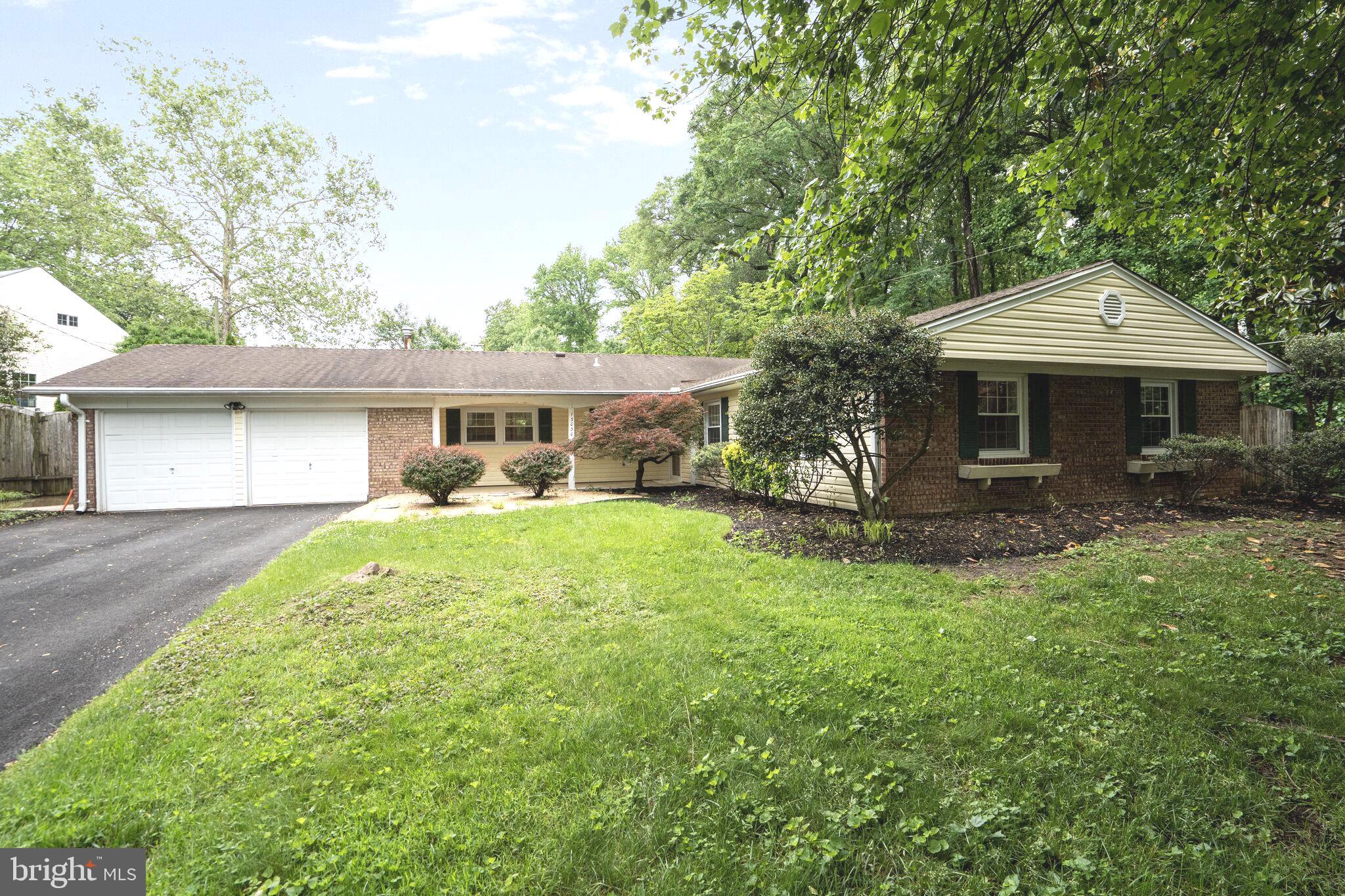 13030 Maple View Lane Fairfax, VA 22033 - Photo 26 of 30 a front view of a house with a garden