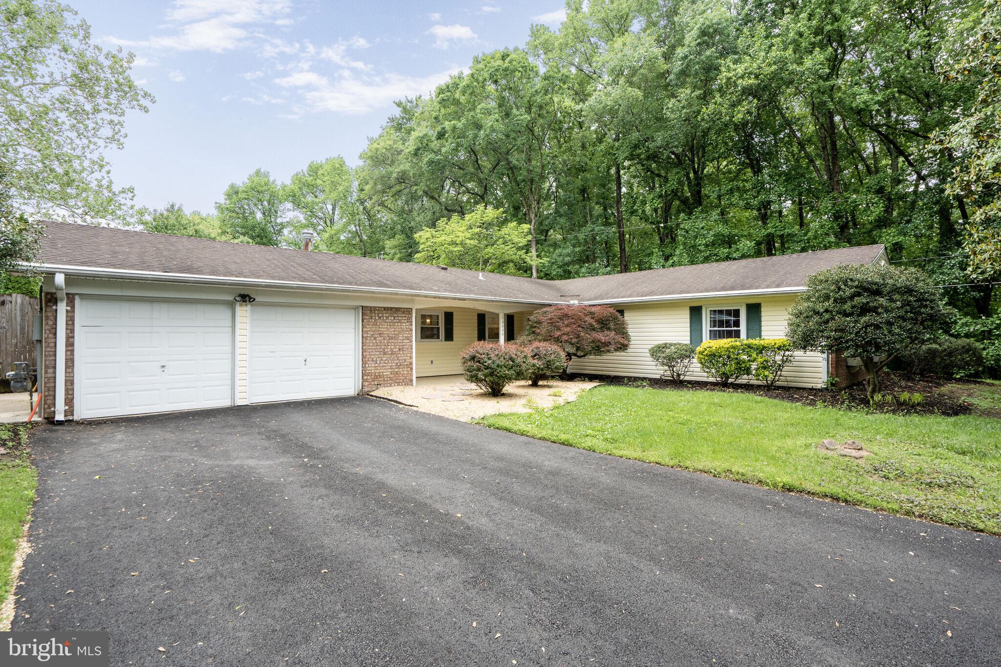 13030 Maple View Lane Fairfax, VA 22033 - Photo 27 of 30 front view of a house with a patio and a yard