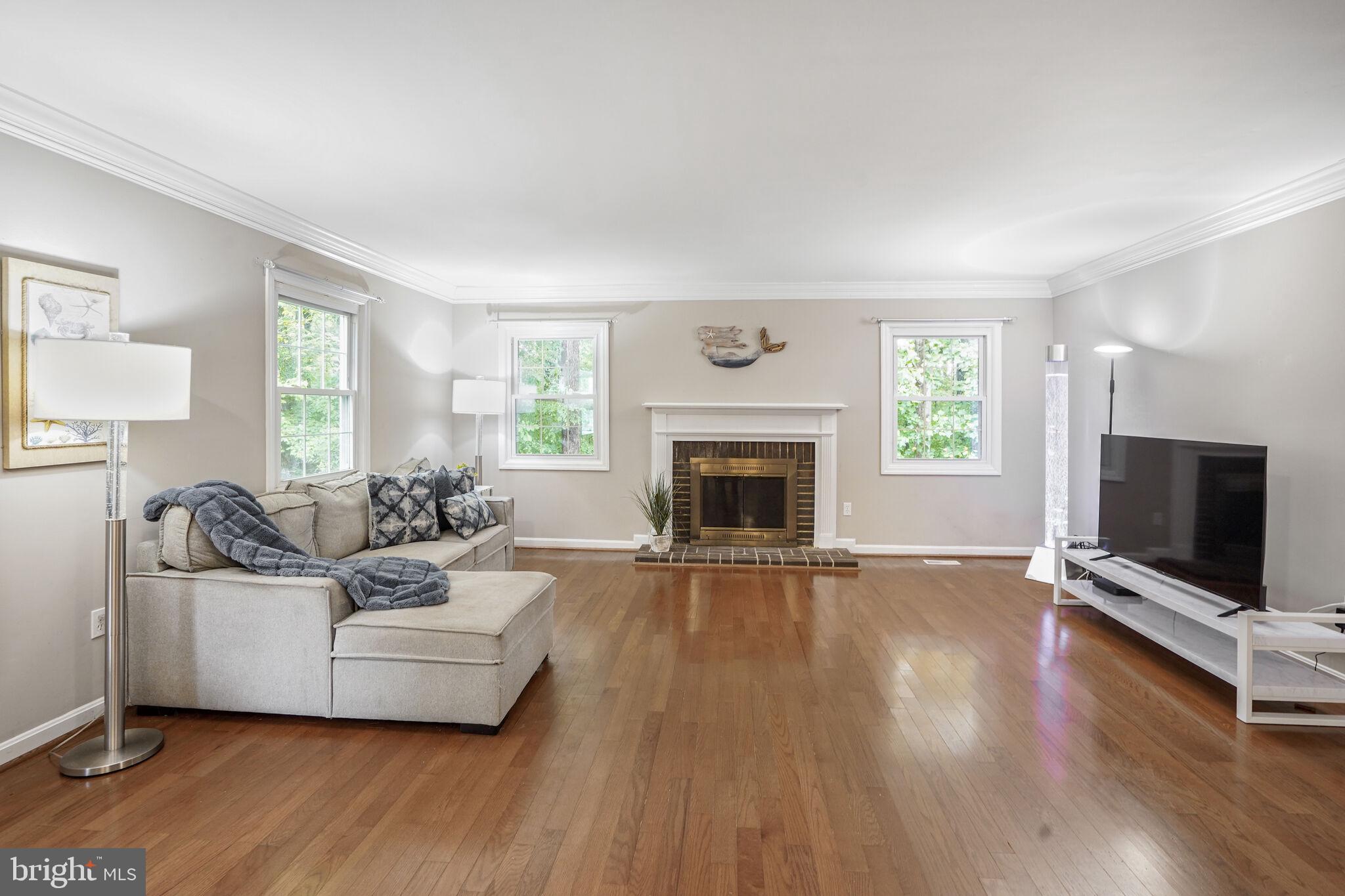 13030 Maple View Lane Fairfax, VA 22033 - Photo 5 of 30 a living room with furniture and a fireplace