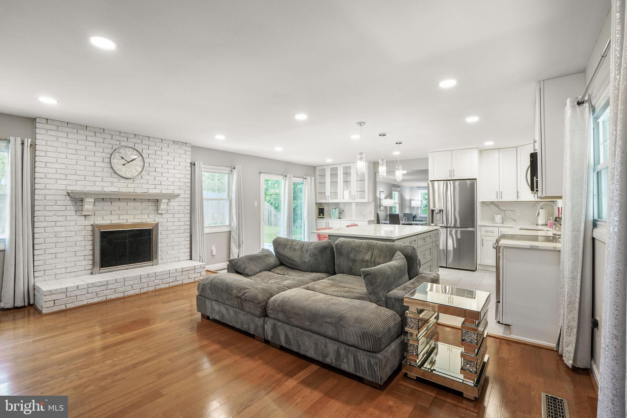 13030 Maple View Lane Fairfax, VA 22033 - Photo 7 of 30 a living room with furniture and a fireplace