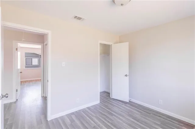 a view of hallway with wooden floor