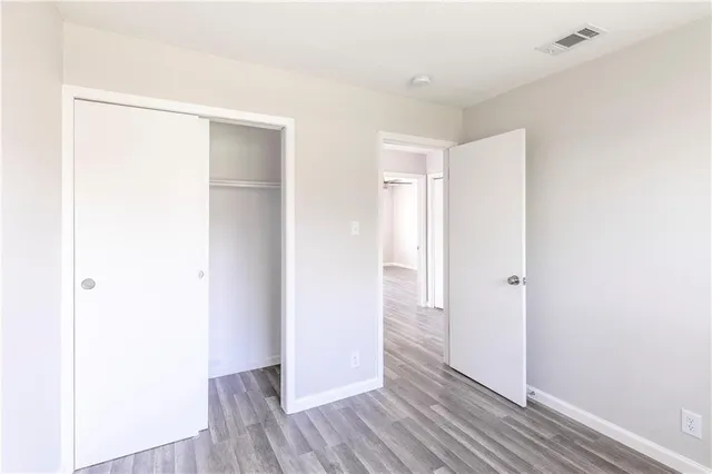 a view of hallway with wooden floor