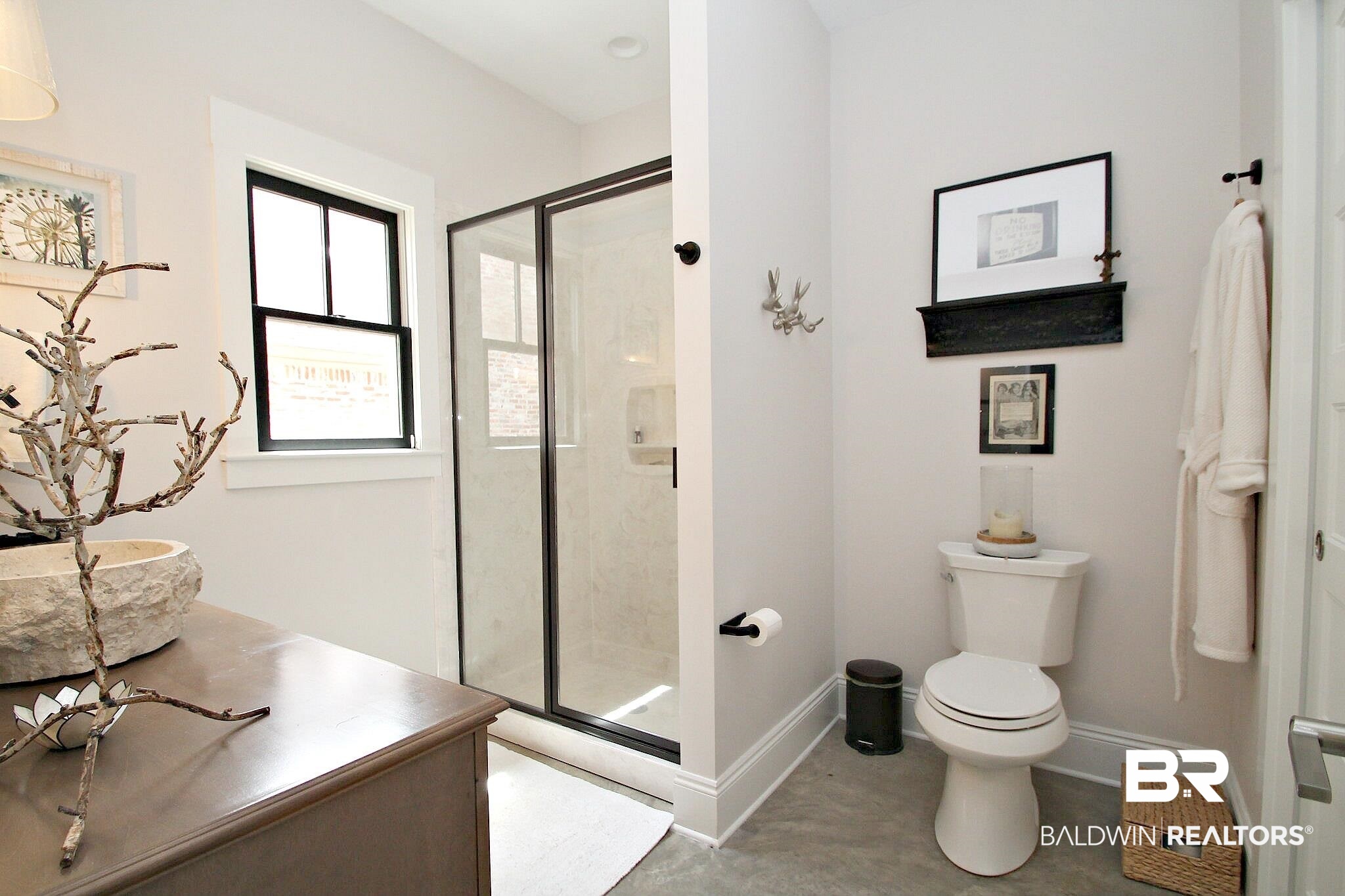 3415 Rue Royal Mobile, AL 36693 - Photo 13 of 31 Full bath featuring a shower stall, toilet, vanity, baseboards, and concrete flooring
