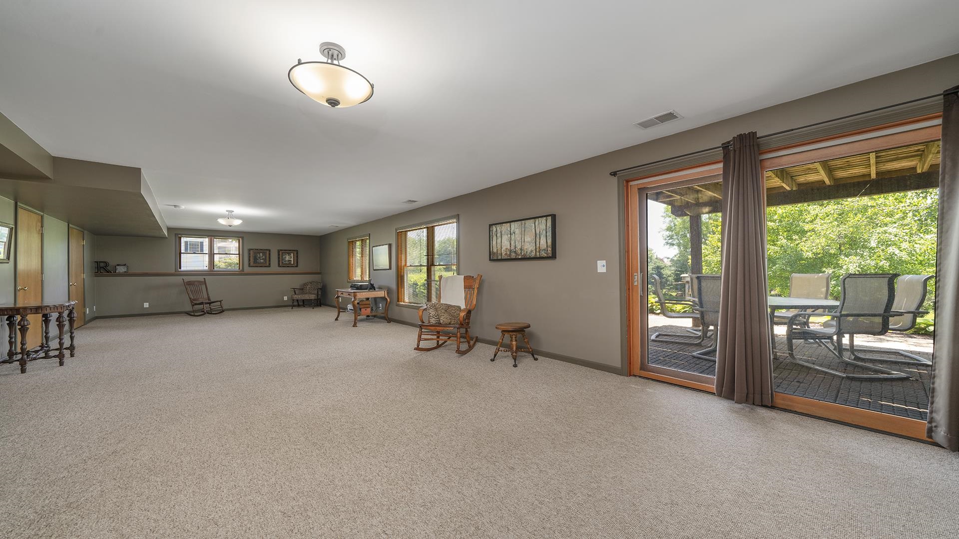 4317 Ridgeview Lane Byron, IL 61010 - Photo 25 of 41 a view of a livingroom with furniture and windows