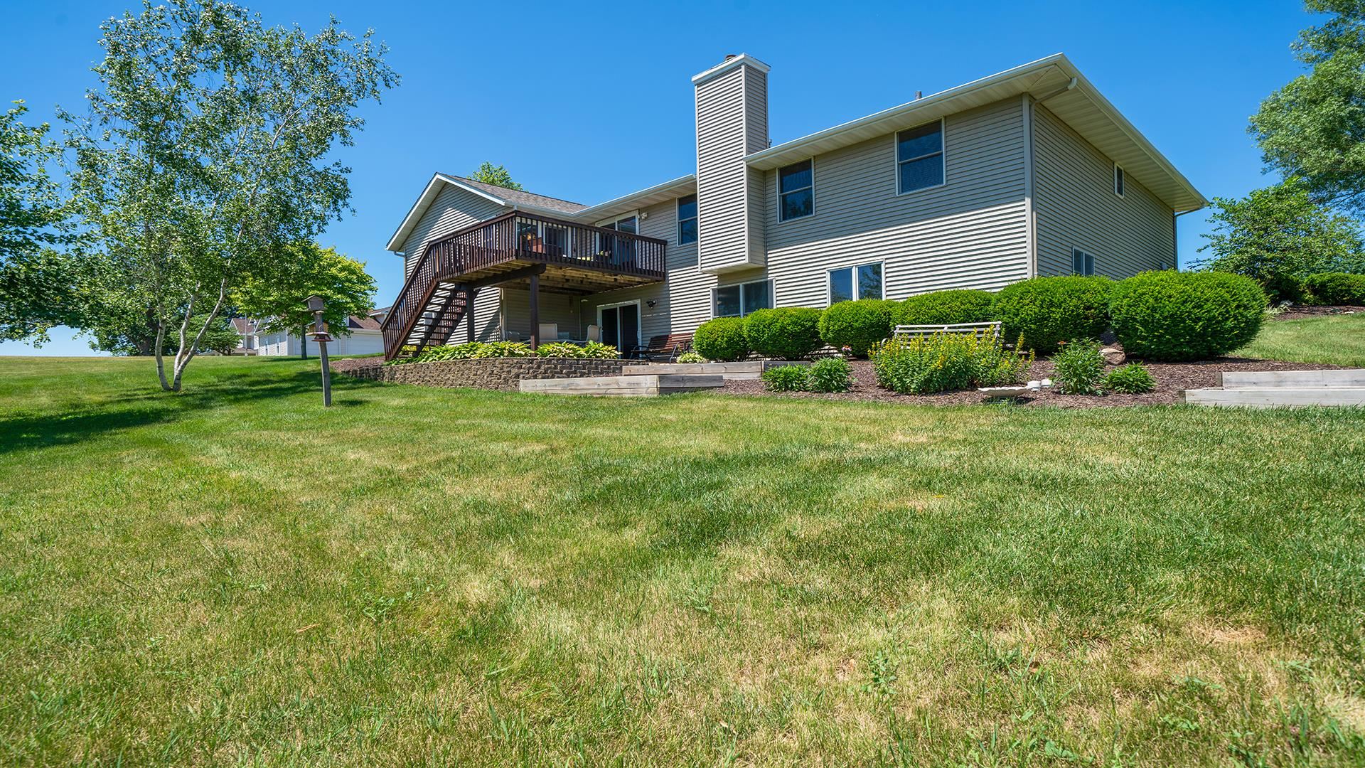 4317 Ridgeview Lane Byron, IL 61010 - Photo 29 of 41 a front view of a house with a yard