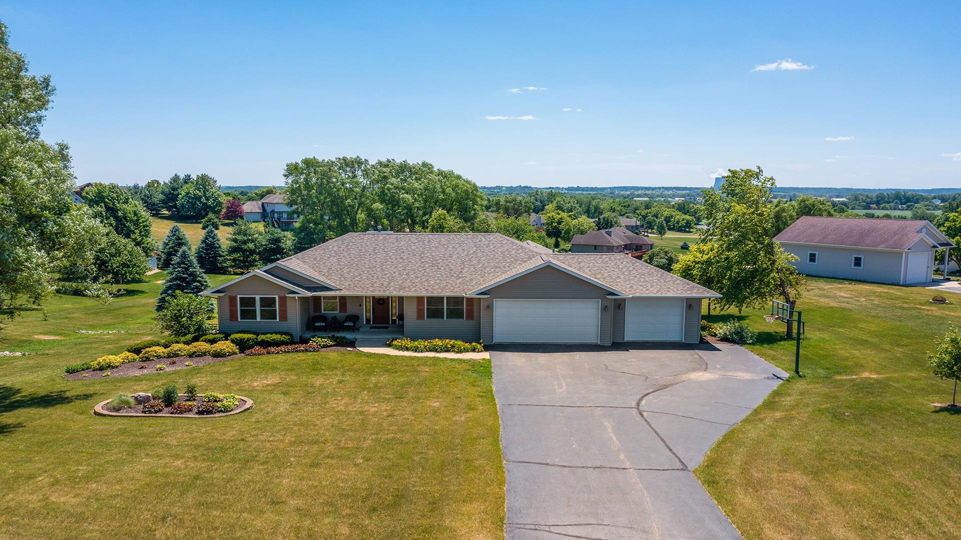 4317 Ridgeview Lane Byron, IL 61010 - Photo 36 of 41 a view of a house with pool and chairs