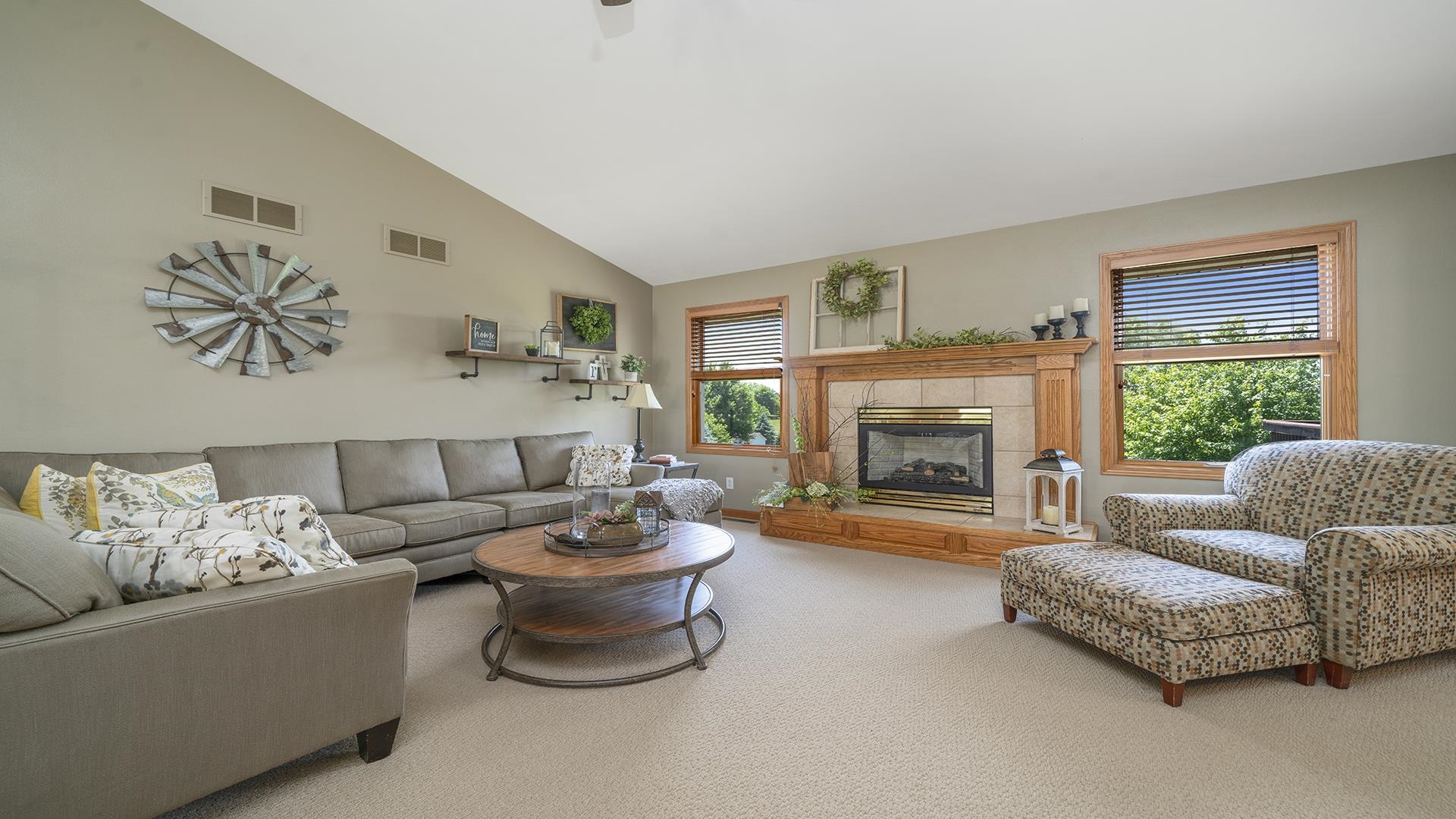 4317 Ridgeview Lane Byron, IL 61010 - Photo 4 of 41 a living room with furniture and a fireplace
