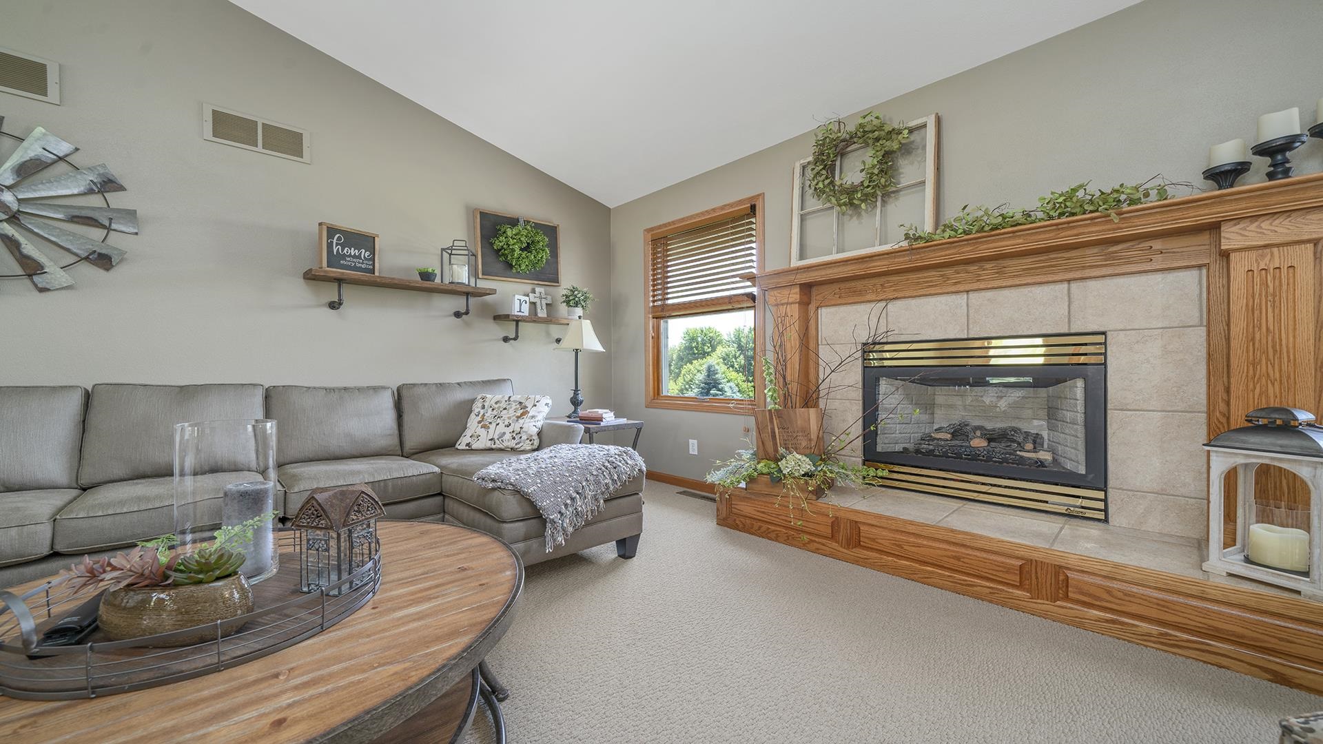 4317 Ridgeview Lane Byron, IL 61010 - Photo 6 of 41 a living room with furniture a fireplace and a large window