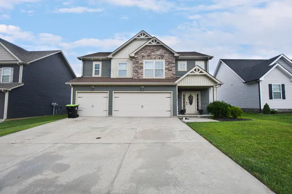 front view of a house with a yard