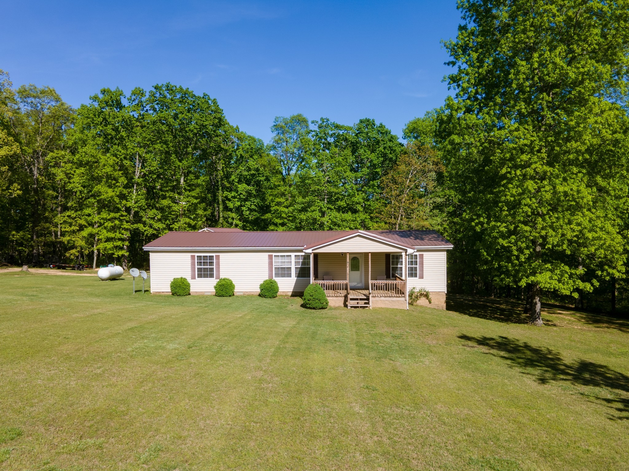 5147 Spears Road Centerville, TN 37033 - Photo 1 of 40 a view of a house with a yard and sitting area