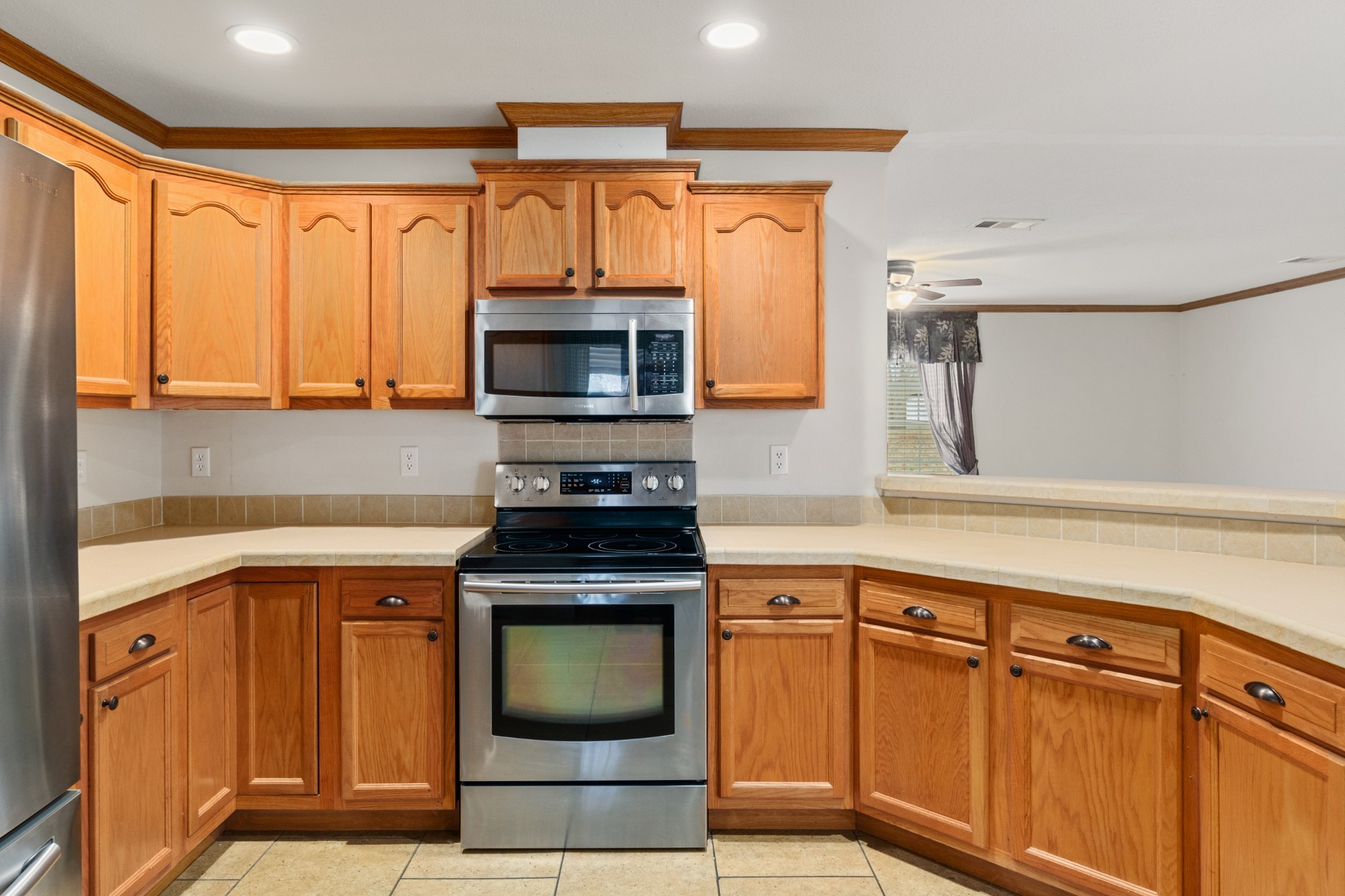 5147 Spears Road Centerville, TN 37033 - Photo 19 of 40 a kitchen with stainless steel appliances granite countertop a stove microwave and sink