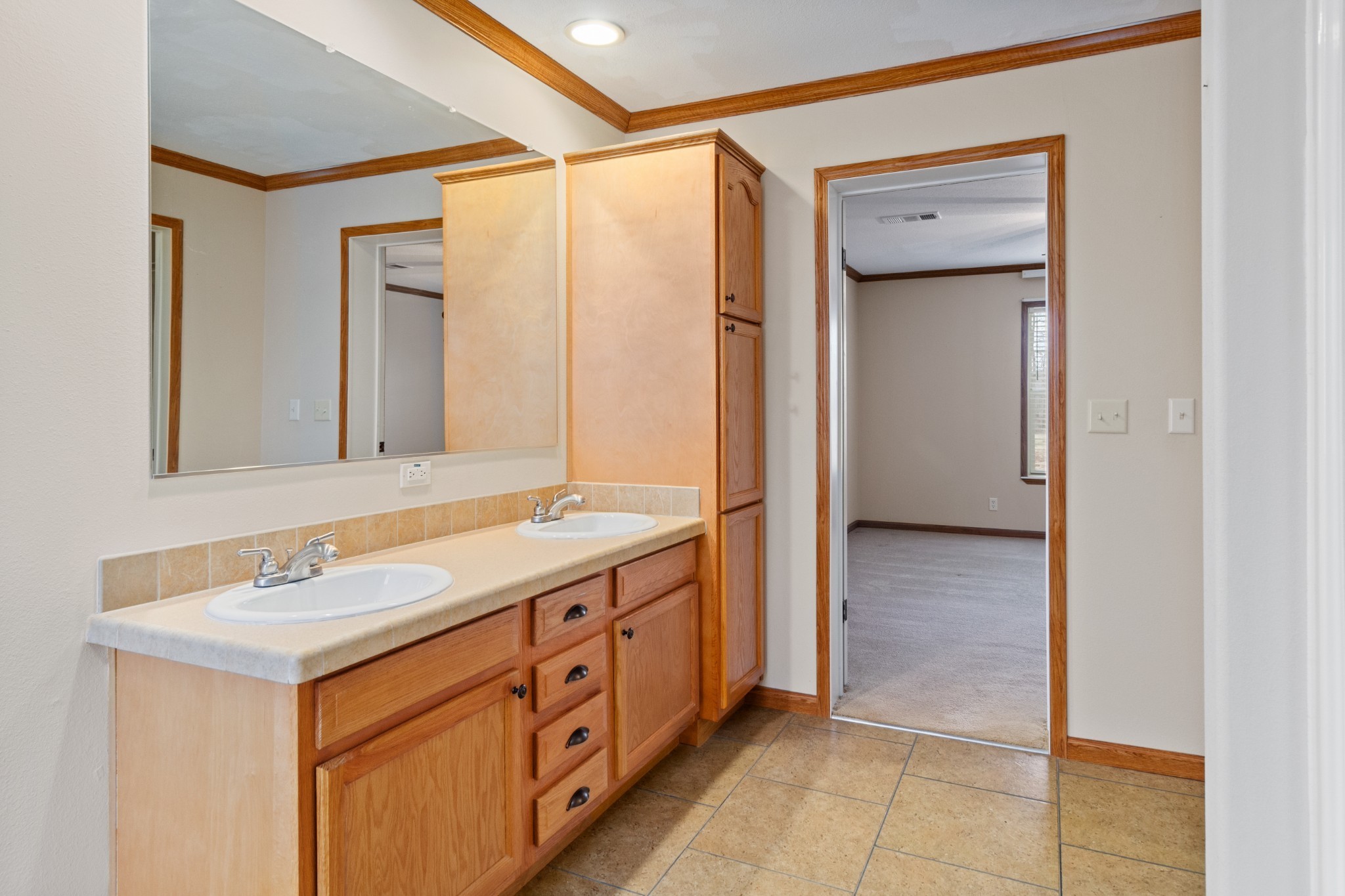 5147 Spears Road Centerville, TN 37033 - Photo 24 of 40 a spacious bathroom with a double vanity sink and a mirror