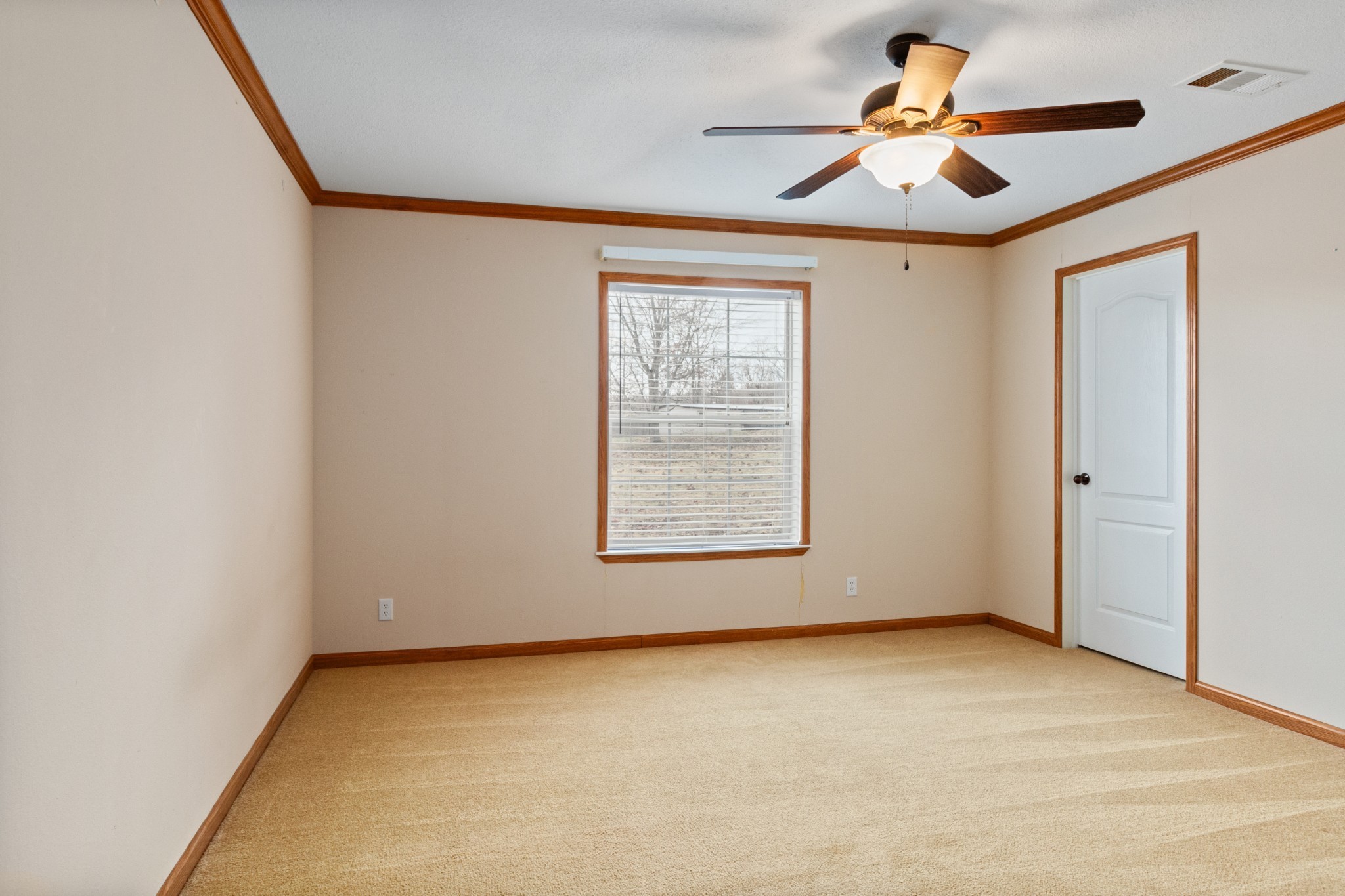 5147 Spears Road Centerville, TN 37033 - Photo 27 of 40 an empty room with a window and a ceiling fan