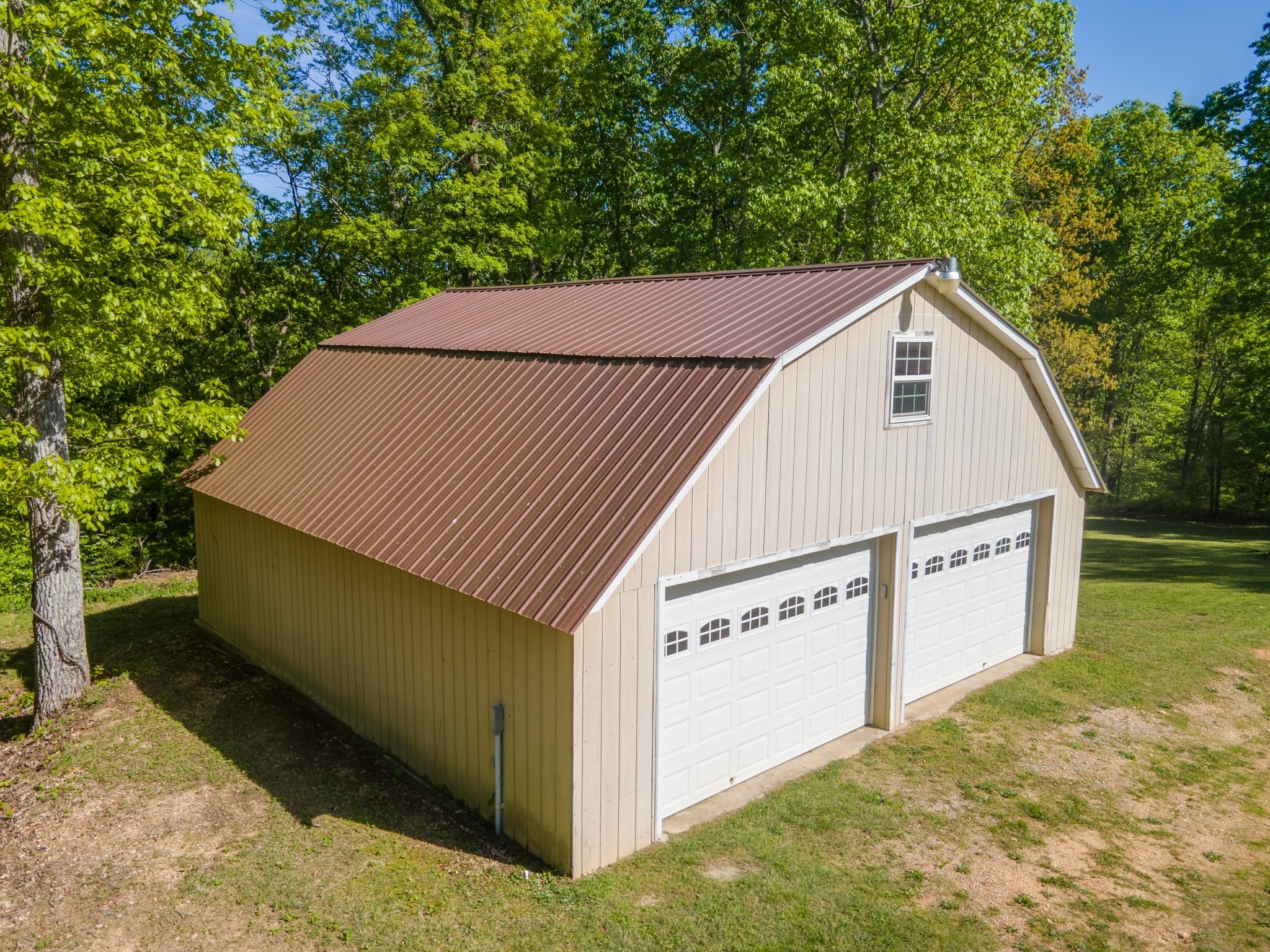 5147 Spears Road Centerville, TN 37033 - Photo 6 of 40 a view of a white house with large trees