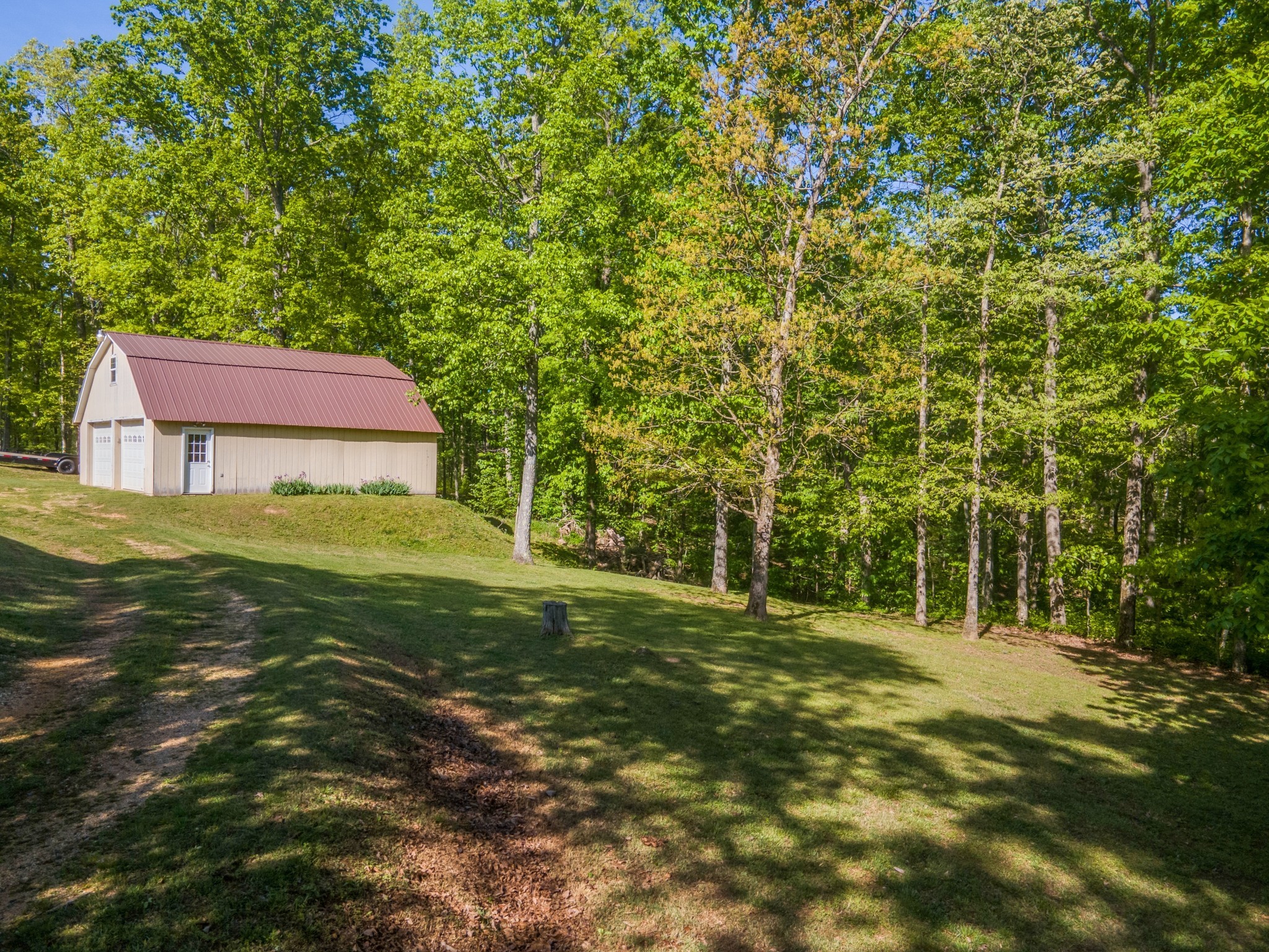 5147 Spears Road Centerville, TN 37033 - Photo 7 of 40 a backyard of a house with lots of green space and fountain