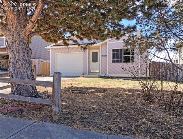 6335 Bismark Road Colorado Springs, CO 80922 - Photo 2 of 21 View of front of house with a garage