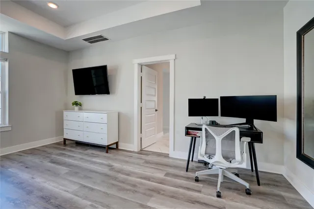 a view of a livingroom with furniture and a flat screen tv
