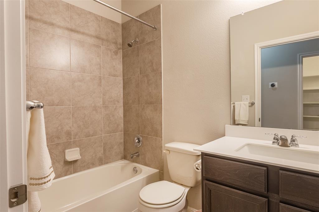 658 Nautical Loop Kyle, TX 78640 - Photo 15 of 18 a bathroom with a sink a toilet and shower