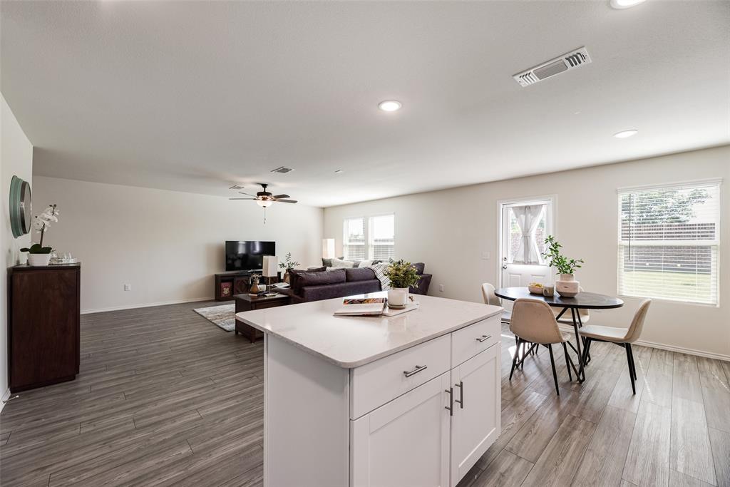 7005 Adderly Road Pilot Point, TX 76258 - Photo 11 of 38 Kitchen island ready for you to pull up a bar stool and chit chat. Island also has storage capabilities.